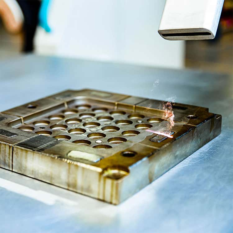 a mould tool being laser cleaned